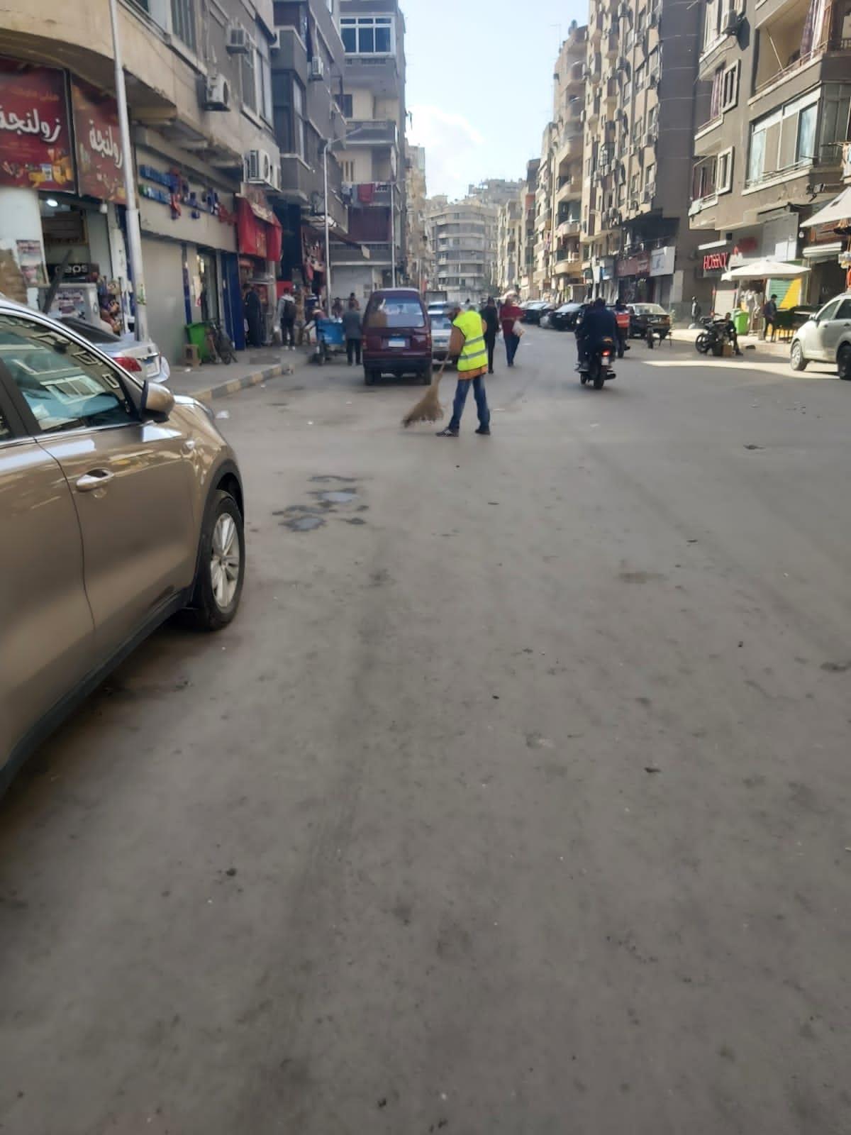 حملة نظافة بشوارع حي الدقي بالجيزة