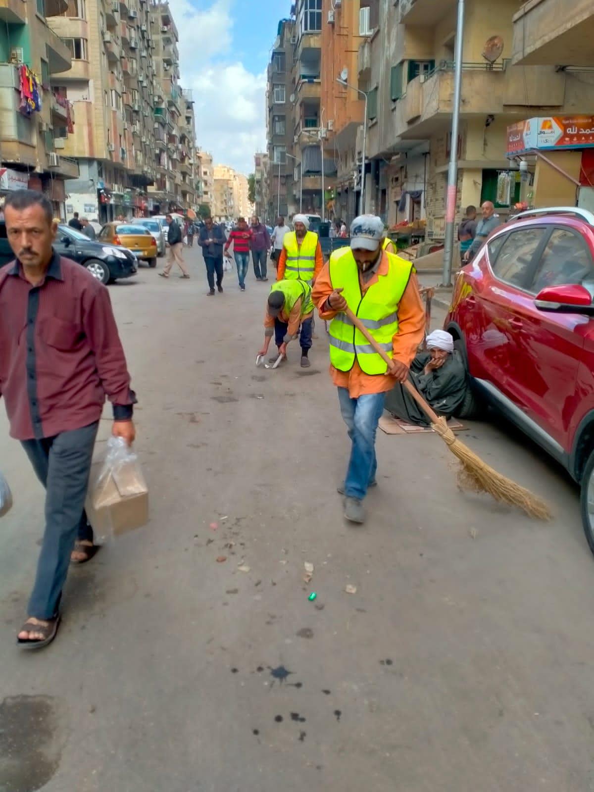 حملة نظافة بشوارع حي الدقي بالجيزة
