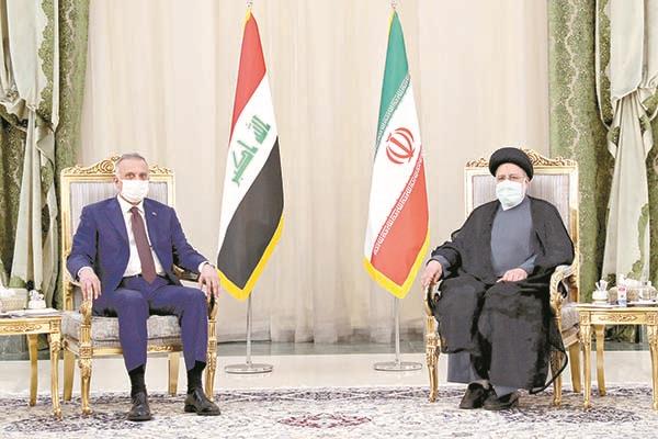 الرئيس الإيرانى أثناء لقائه مع الكاظمى فى طهران   