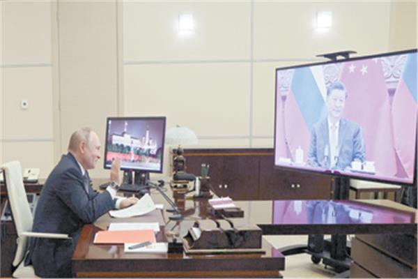 بوتين أثناء اجتماع افتراضى مع نظيره الصينى 