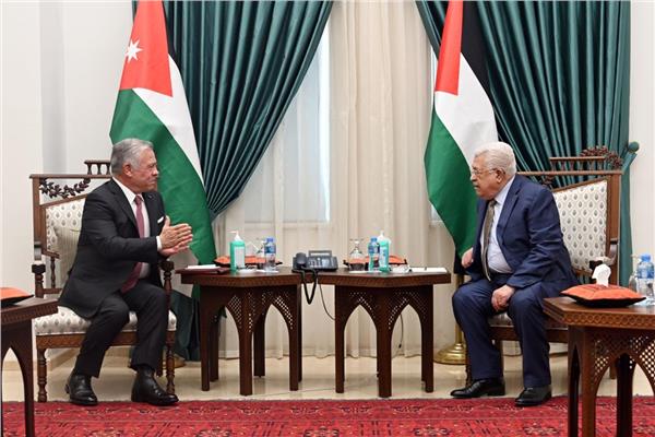 الرئيس الفلسطيني مع العاهل الأردني 