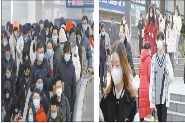 صينيون يرتدون كمامات للوقاية من فيروس كورونا فى العاصمة بكين