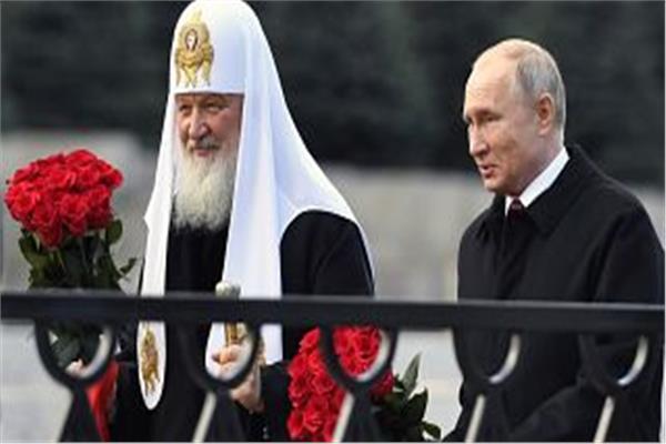  الرئيس الروسي فلاديمير بوتين وراعي الكنيسة الأرثوذكسية البطريرك كيريل