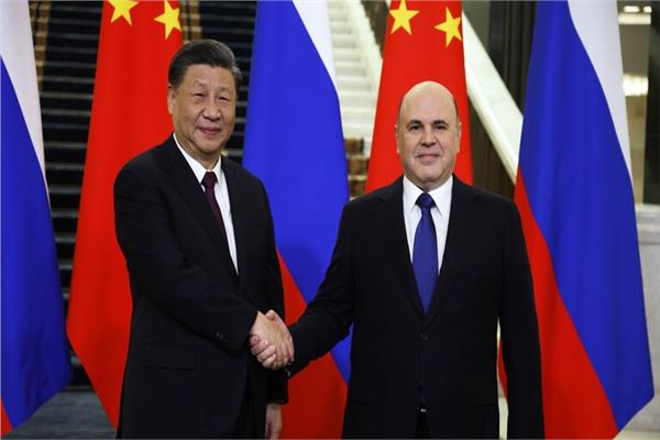 رئيس الوزراء الروسي ميخائيل ميشوستين والرئيس الصيني شي جين بينج