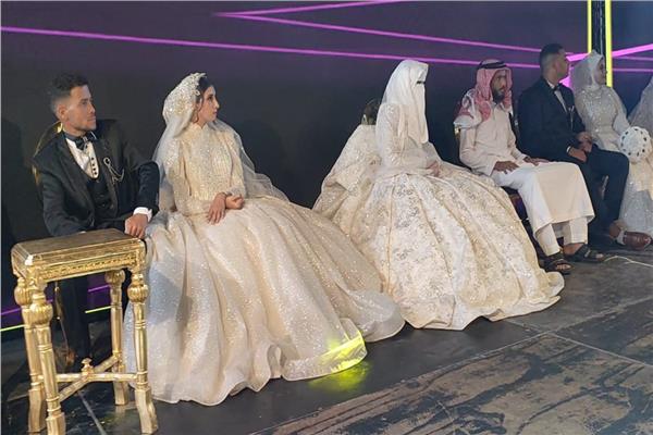 حفل زفاف لـ15 عريس وعروسة بالعريش