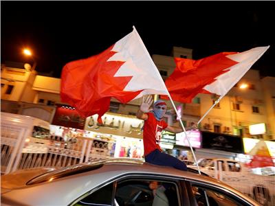 صور| شوارع المنامة تتزين بـ«الأحمر والأبيض» عقب تتويج البحرين بـ«خليجي 24»