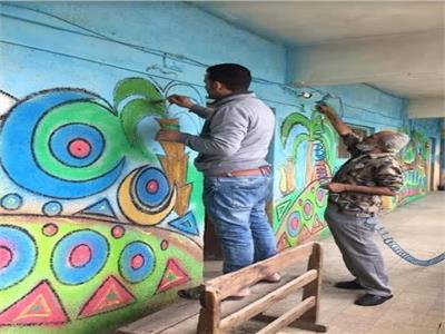 صور| مدارس القاهرة تتحول إلى لوحة فنية