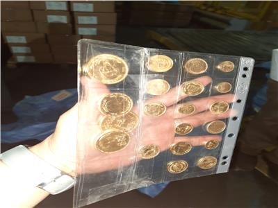 جمارك الطرود البريدية تضبط تهريب عدد من العملات الذهبية التذكارية| صور