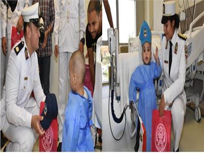 ضباط وطلاب أكاديمية الشرطة يوزعون الهدايا على الأطفال المرضى