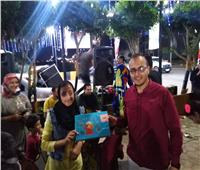 صور.. «شارع ٣٠٦»  يستقبل زائريه بأجواء الاحتفال بالمولد النبوي