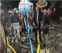 صور| تكدس مروري بسبب كسر ماسورة مياه بشارع التحرير بالدقي