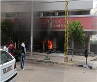 صور| سقوط جريح وحرق واجهات البنوك بطرابلس اللبنانية