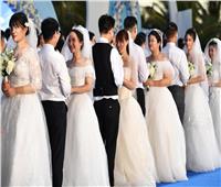 بالصور | الصين تُكرم محاربي كورونا بحفل زفاف جماعي