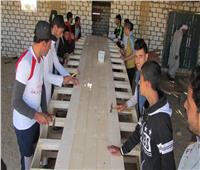 شباب «قرية النجاح» بشمال سيناء يبدعون في صناعة المراكب الخشبية