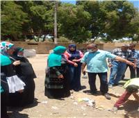 حملة نظافة وتشجير وندوات توعية بقرية بني مر بأسيوط