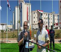 مراسم رفع علم مصر على مدخل القرية المتوسطية بالجزائر 