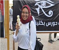 توزيع حلوى المولد النبوي الشريف في معسكر استقبال الطلاب بحقوق قنا