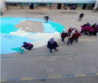 كوكب الارض داخل فناء مدرسة شبرا لشرح أثار التغييرات المناخية 
