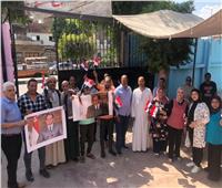 أعلام مصر ترفرف أمام الشهر العقاري بإمبابة لعمل توكيلات تأييد للرئيس السيسي