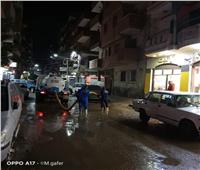 سحب تجمعات مياه الأمطار بشوارع الشهداء