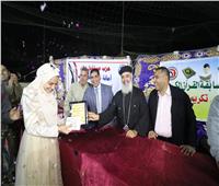 كاهن كنيسة بكفرالزيات يشارك في احتفالية لتكريم حفظة القرآن الكريم