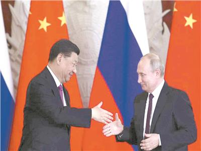 الرئيس الروسى فلاديمير بوتين ونظيره الصينى شى جين بينج خلال لقائهما فى الكرملين عام ٢٠١٩