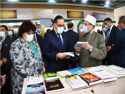 مدبولى ووزير الأوقاف خلال افتتاح معرض الكتاب
