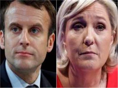 الرئيس الفرنسي المنتهية ولايته "إيمانويل ماكرون" و المرشحة اليمينية المتطرفة "مارين لوبن"