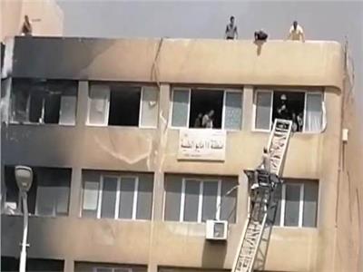 أمن القاهرة يستخدم سالالم لانقاذ الموظفين في حريق جهاز 15 مايو 