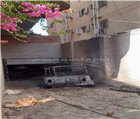 بالصور.. إخماد حريق "توك توك" داخل جراج بحدائق الأهرام
