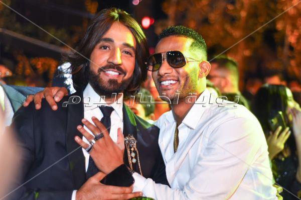 الهضبة ودينا الشربيني وراغب ومحمد رمضان في زفاف «باسل سماقية»