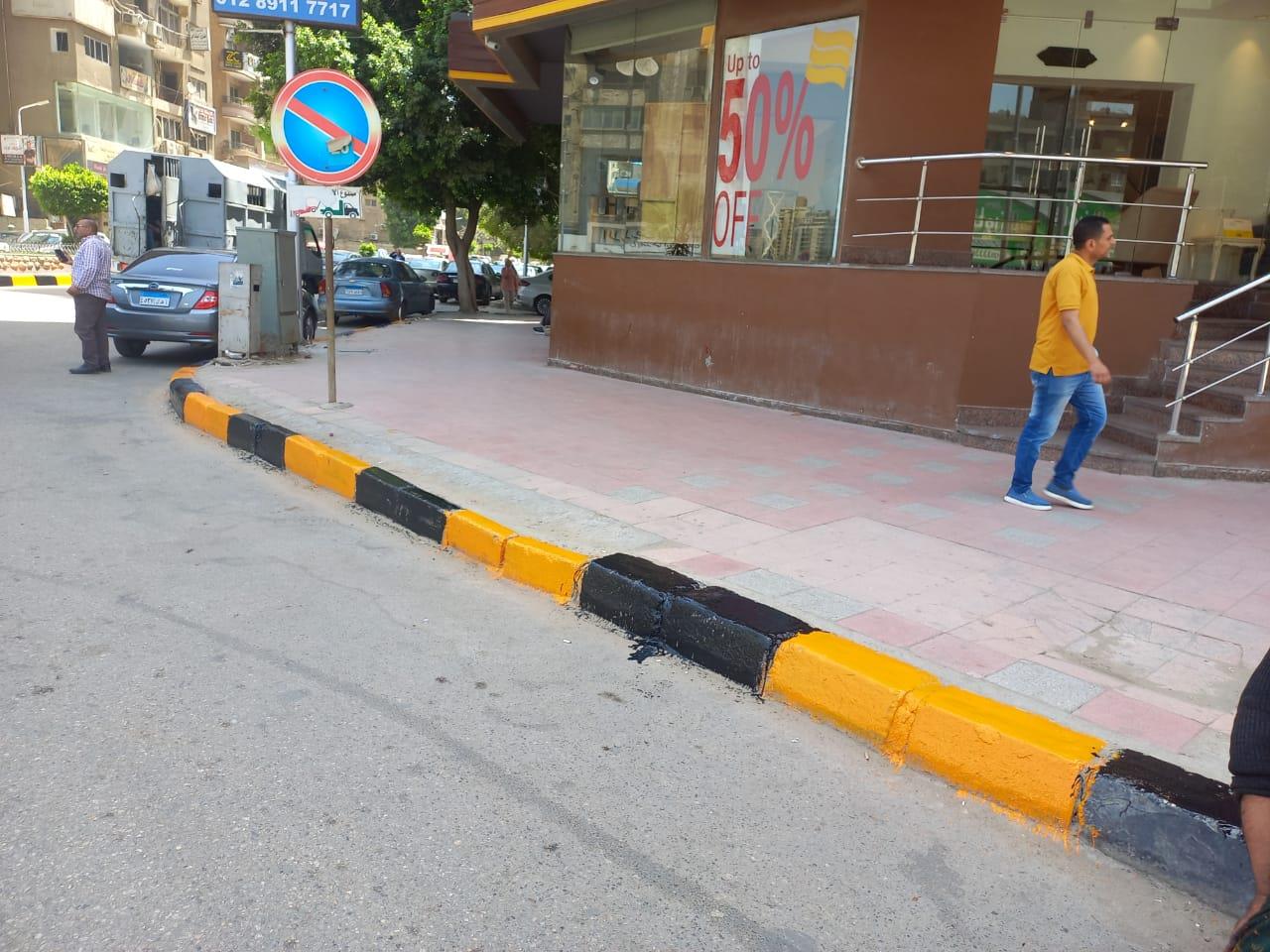 تطوير وطلاء أرصفة بشوارع الدقي في الجيزة