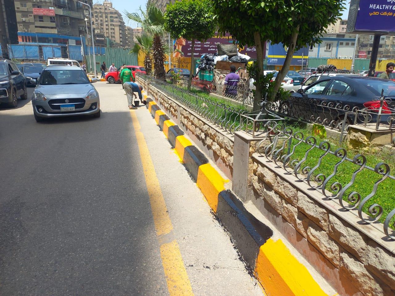 تطوير وطلاء أرصفة بشوارع الدقي في الجيزة