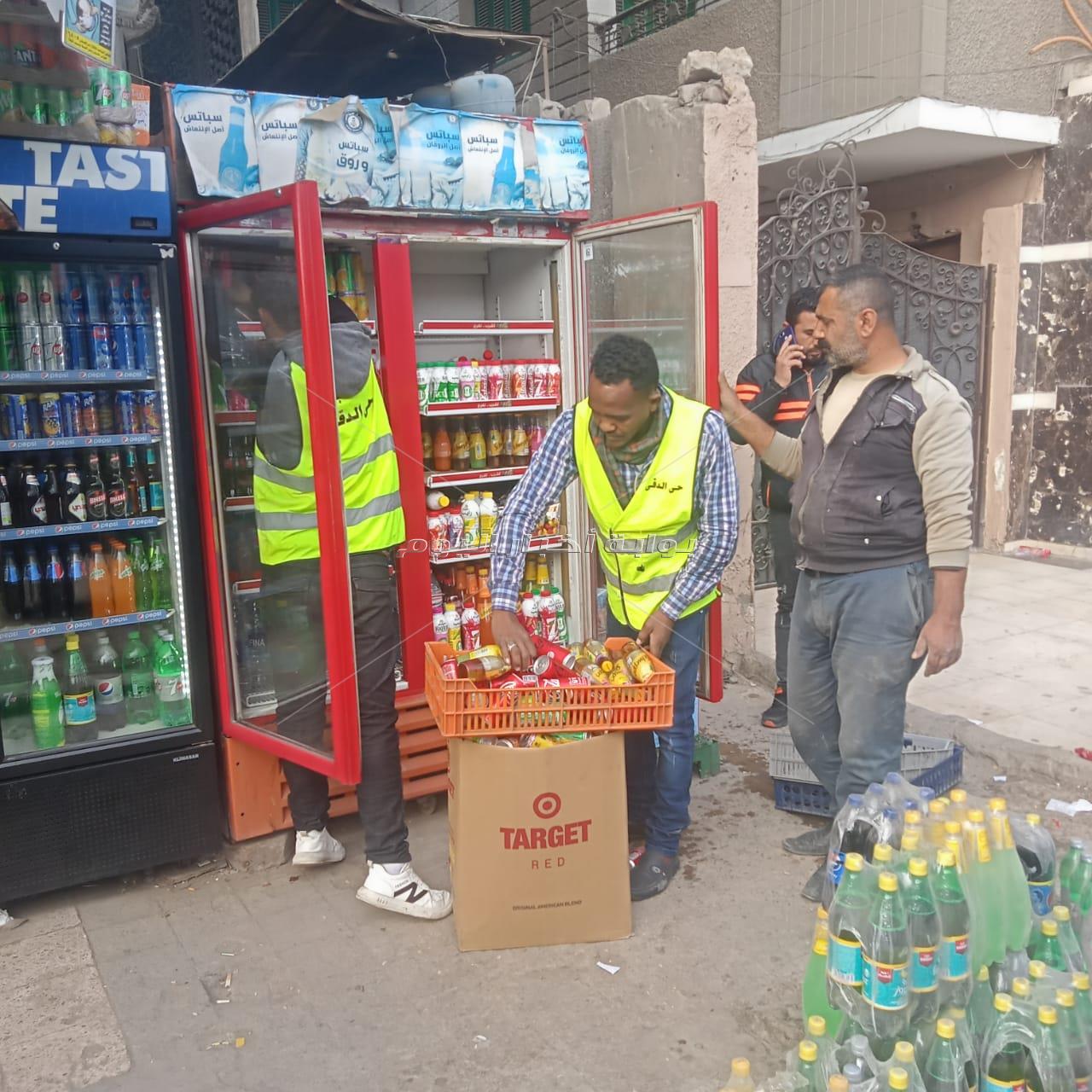 غلق وتشميع محال تجارية مخالفة لتكرار إشغال الطريق بالدقي