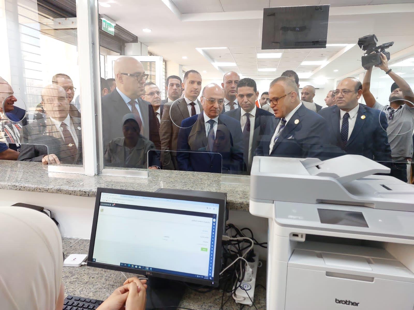 المستشار عمر مروان- وزير العدل والدكتور عاصم الجزار- وزير الإسكان وجانب من الافتتاح