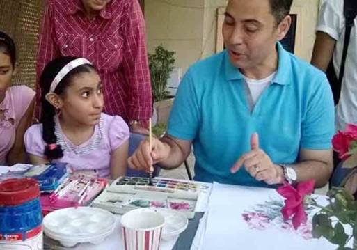 ورش فنية في الرسم بالرمال