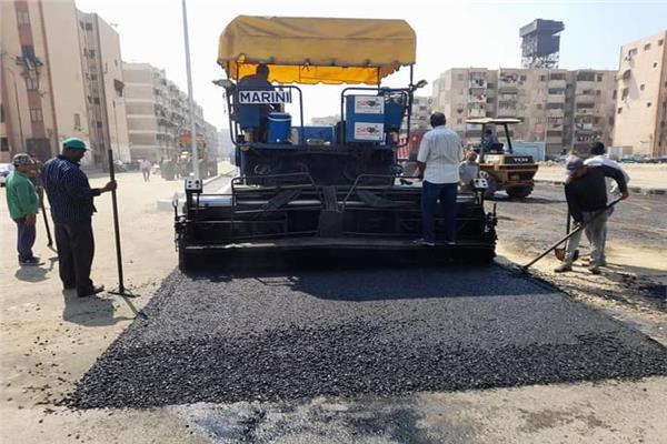 أعمال رصف طريق مستجد بحى الضواحى 