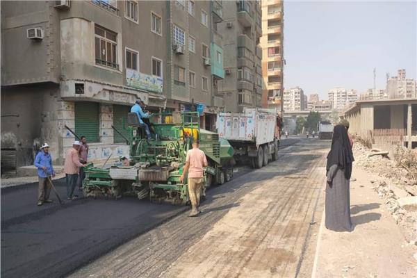 فرد الطبقة الأسفلتية بشارع الثلاثيني الجديد بالطالبية