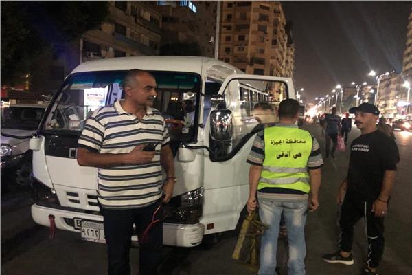 الغرامة الفورية لغسيل السيارات في الطريق العام بالدقي