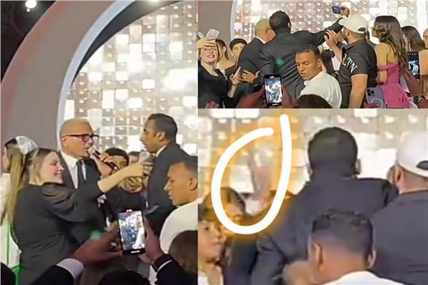 عمرو دياب خلال صفعه أحد معجبيه في حفل زفاف ابنة محمد السعدي