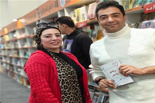 الشاعر والكاتب نادر عيسى مع محررة بوابة أخبار اليوم