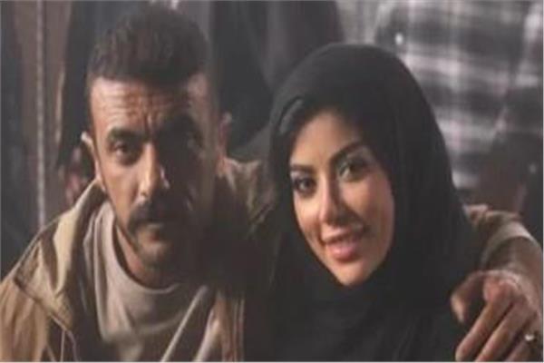 كارولين عزمي وأحمد العوضي
