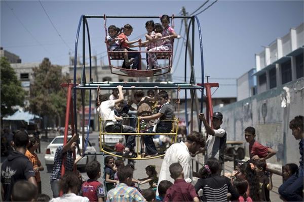 أطفال غزة يحتفلون بالعيد - صورة أرشيفية