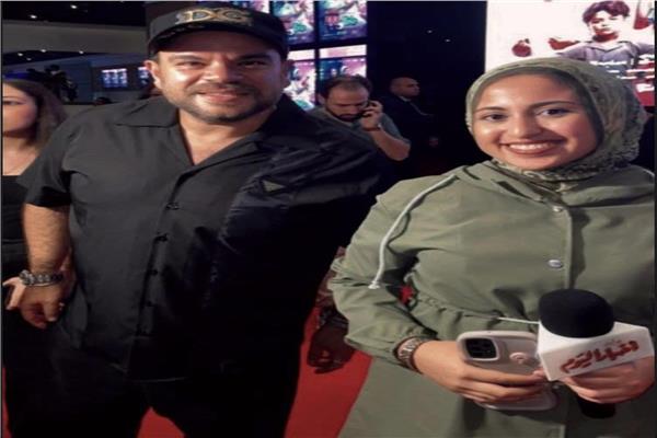 محمد عبد الرحمن «توتا» ومحررة أخبار اليوم 