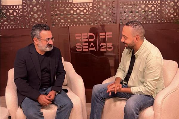 جورج خباز ومحرر بوابة أخبار اليوم