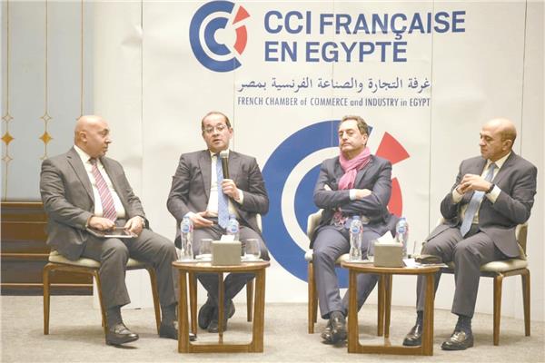 وزير المالية والسفير الفرنسى خلال ندوة غرفة التجارة والصناعة الفرنسية بمصر