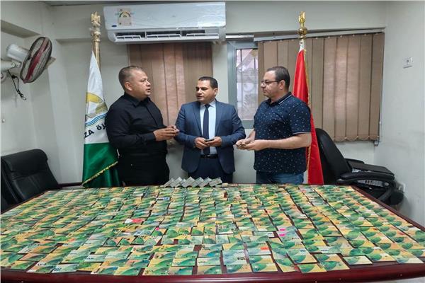 جانب من البطاقة التموينية المضبوطة
