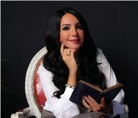 صور| إنجي علاء الأكثر مبيعا في معرض الكتاب برواية «الأشقر مروان»