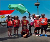 صور| أطفال «متلازمة داون» يشجعون منتخب مصر