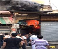 بالصور والفيديو .. السيطرة على حريق ضخم في سوق الخضار بالعتبة